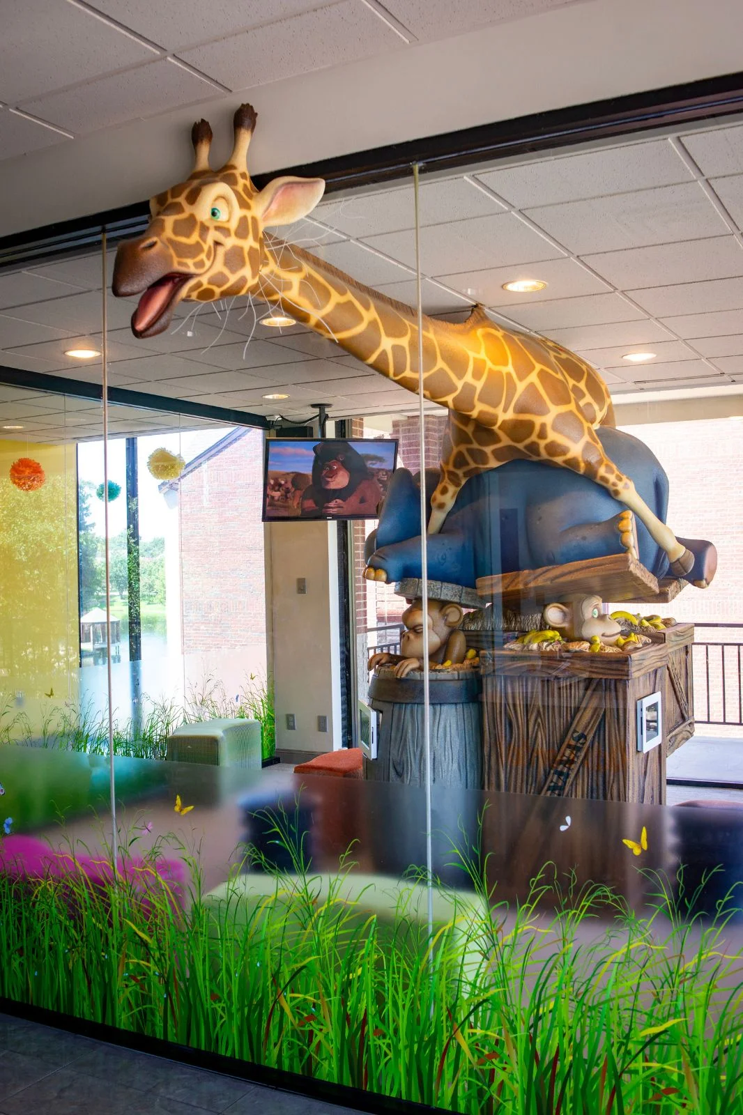 Hallway with bright murals at Just Kids Dental