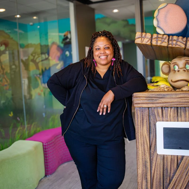 Dentist and child during first pediatric dental visit in Dallas